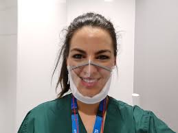 We're showcasing our #StaffBehindTheMask. Dr Fizz Izagaren works at Evelina  London in children's emergency medicine. "Normal masks can make  communication difficult for deaf people and those with communication  difficulties as they cover