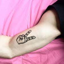 Fingers up peace sign tattoos. Peace Sign Tattoo Peace Sign Tattoos Finger Tattoos Tattoos