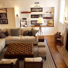 A sturdy leather ottoman also provides additional comfortable seating for guests. Brown Leather Ottoman Coffee Table Cottage Living Room Giannetti Home