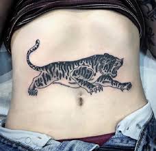 As you know a tiger tattoo is a symbol of a power and a strength, so you can repeat an ideas with an aggressive tiger and place it on your neck (making it on the front of your neck will be a very bold choice). Top 30 Tiger Tattoos For Men Women Beautiful Tiger Tattoo Designs