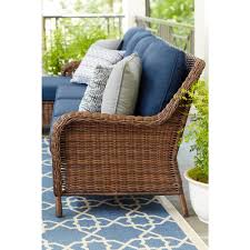 Combining comfort and style, this chair features a durable steel frame wrapped in wicker with a plush seat and back cushion. Torquay Collection Outdoors The Home Depot Vozeli Com