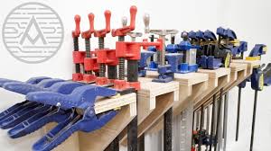 It holds about 50 clamps, takes up a little more than four square feet of floor space and can honestly be built in an afternoon. Diy Universal Clamp Rack Woodworking Youtube