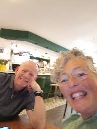 A couple of different views of the Bonney Tavern. Horse and buggy days and  a visit from a cycling group.