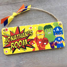 Personalised with their names and favourite colours for them. Personalised Superhero Plaque Bedroom Door Sign Laura Godbold Design