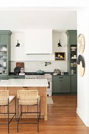 White shaker cabinets are some of the easiest cabinets to style because of their versatility and timelessness. Gray Green Shaker Cabinets In A Kitchen Remodel Town Country Living