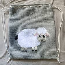 Teresa kogut cross stitch pattern from teresa kogut featuring two lambs with flowers! Cross Stitched Lamb Cinched Backpack
