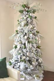 These bedding items will give your bedroom a nature inspired feel with the finest quality fabrics. Flocked Green And White Pine Cone Themed Christmas Tree Home With Holliday