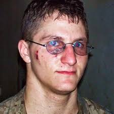 U.S. Marine who survived a bullet through his glasses after giving the  middle finger to an enemy sniper in the Battle of Ramadi, Iraq (2006)