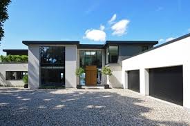 Soffits, fascia and windows covered in dark bronze aluminum. Aluminium Used In Contemporary Home Design Husk Architectural