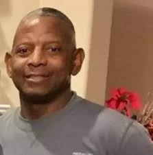 Odell Beckham (senior) and Shaquille O'Neal talking with two young ladies 