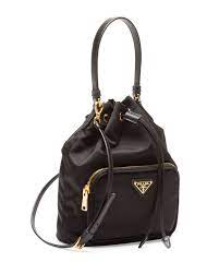 The women's bucket bag line in leather or nylon stands out for its structured designs and modern details. Prada Tessuto Nylon Bucket Bag Off 77 Www Amarkotarim Com Tr