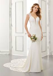 The wide butterfly sleeves and the elaborate embroidery complete the impression of grace that emanates. Sheath And Fit To Flare Wedding Dresses Morilee