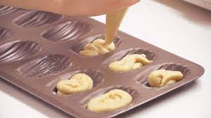 Press dough into mold, scraping excess off with a knife so that dough is flush with the edge of the mold. How To Prep Use A Baking Mold Better Your Bake By Nielsen Massey