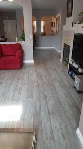 We Love This Floor The Color Just Made The Room Look So Much Bigger The Color Changes With The Lighte Flooring Laminate Flooring On Walls Driftwood Flooring