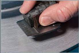 This is a good moment to tidy everything before you move onto sharpening the blade with the stone, so refresh your water, and neaten your area. How To Sharpen Clipper Blades With Aluminium Foil My Beard Gang