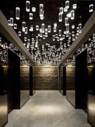 Ceiling Lighting Design Pendants And Mirror Combination Within A Lift Lobby Hotel Lobby Design Lobby Design Lighting Design Interior