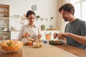 Couple Eating Dinner In The Kitchen Dinner Eat Kitchen