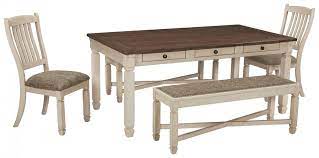 As a dining table can be an expensive investment, you will need to take your time in your searching to tick off the key criteria you hope the table will meet more than that, to ensure the sturdiness of the dining table set with bench, its legs are made of a good quality of metal and finished with white coat. Bolanburg Dining Table And 2 Chairs And 2 Benches D647 00 2 01 2 25 Dining Room Groups Furniture Cabinet Outlet Centers