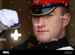 Blues and Royals Trooper Christopher Finney with his George Cross after  being decorated by Britain's Queen Elizabeth II at an investiture for  services in Iraq at Buckingham Palace, London. Christopher Finney, 19,