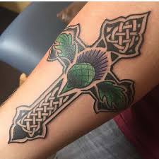 Tattoos such as the one seen below inked in the inner wrist of a woman symbolize the wearer's love for music. Thistle Tattoo Celtic Cross Best Tattoo Ideas Gallery