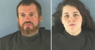 2 people arrested after body found in Okeechobee street