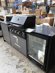 Complete your outdoor decor with a beautiful, custom made barbecue island or outdoor kitchen. Ex Display Black Stone Outdoor Bbq Kitchen With Bar Fridge Outdoor Laminate Doors With S Steel Bar Fridge With Black Euro 4 Burner Bbq Eal900rbqbl With 6 Month Warranty Fowles Auction Sales