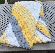 A simple crochet blanket pattern perfect for beginners, using bernat baby blanket or size 6 super bulk yarn and 11.5mm (p16) hook. Creampuff Revolution Creampuff Reviews Bernat Baby Blanket Stripes Yarn
