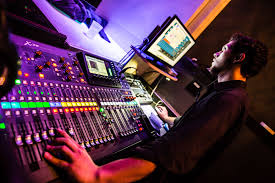 sound and light technician at the sound booth at the