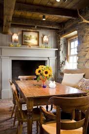 The casual table, bench seating, loosely slipcovered chairs and everyday dishware all indicate daily use, but the exquisite chandelier proves the space can easily be dressed up for more elegant occasions. Image Result For English Farmhouse Dining Room Cottage Dining Rooms Cottage Fireplace Country Cottage Decor