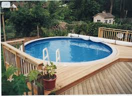 Calimar oval above ground pool installation. Cool Above Ground Pool Decks To Use As Inspiration For Your Own