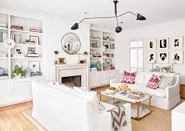 White wall living room decor. 9 Decorating Ideas That Make White Walls Anything But Boring White Walls White Walls Living Room Living Room Decor Apartment