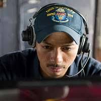 Operations Specialist 2nd Class Abel Santos, from Reno, Nevada, stands  watch aboard Arleigh Burke-class guided-missile destroyer USS Sterett (DDG  104) during Talisman Saber 17.