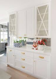 Foxy, alluring and cool are just some of the ways to describe these modern spaces, which stop calling white kitchens boring! White Cabinets Gold Hardware Design Ideas