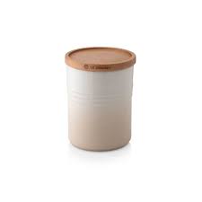 Le creuset stoneware and dinnerware ranges are now covered by an uncompromising 10 year guarantee, giving you the ultimate reassurance in your purchase. Le Creuset Medium Storage Jar With Wood Lid Meringue Glasswells Bury St Edmunds Ipswich Suffolk