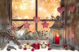 Christmas decoration with lights behind the window. Elegant Christmas Window Decor Ideas