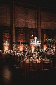 Elegant Industrial Wedding Venue With Chandeliers Wedding Lighting Ideas Industrial Wedding Reception Romantic Wedding Receptions Industrial Wedding Venues
