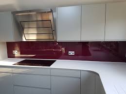 A Lovely Colour Contrast In This Kitchen With A Glass Painted Splashback In Burgundy Kitchen Colors Simple Bathroom Decor Glass Splashbacks Kitchen