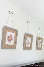 Such A Pretty Way To Hang Pictures Diy Nautical Rope Picture Hangers Picture Hangers Shiplap Wall Diy Rope Decor