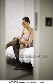 Then put the pantyhose on however you see fit. Woman Putting On Pantyhose Stock Photograph B05956 Fotosearch