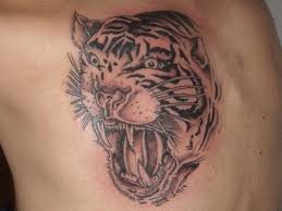 The white tiger with the baby blue eyes is depicted in the natural surroundings. Tiger Tattoo Designs 25 Stunning Collections Design Press