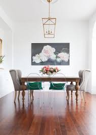 A Vintage Wooden Table And Clear Acrylic Chairs Plus Grey Wingback Ones For A Bold Look Dining Room Contemporary Modern Dining Room Dining Room Decor