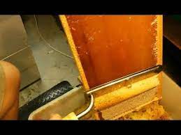 Beeswax Cappings Removed Using A Hot Knife Before Using Honey Extractor Beekeeping 101 Our New Video Shows A Closeup Step B Bee Keeping Bee Honey Extractor