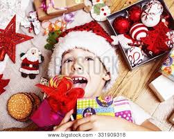 Invite your frndz, share page like. Little Cute Boy With Christmas Gifts At Home Close Up Emotional Happy Smiling In Mess With Toys Li Stock Images Page Everypixel