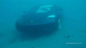 Maybe you would like to learn more about one of these? Photos Divers Salvage Ferrari That Crashes Into Lake Worth Inlet