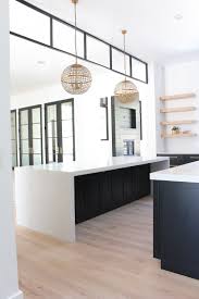 An oversized contemporary kitchen island with a metal base and a butcherblock countertop can be used for cooking and eating there. Our New Modern Kitchen The Big Reveal The House Of Silver Lining