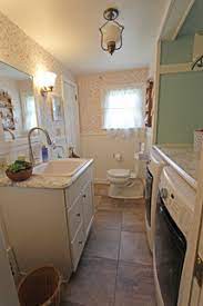 The showering area has glass coverage for making the bathroom a bit spacious. Bathroom Laundry Room Combo Medina Oh 1 Landhausstil Badezimmer Cleveland Von Cabinet S Top Houzz