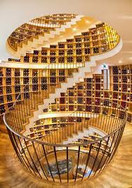 Historically, wine cellars have been buried beneath a vineyard's water bed to ensure sufficient moisture and cool temperatures. The Most Beautiful Wine Cellar Ever Extraordinary Architecture In L Intendant Wine Shop Bordeaux Gironde Aquitane Amazing Architecture Stairs Wine Cellar