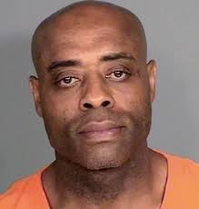 Bank robber who dressed as a woman takes plea