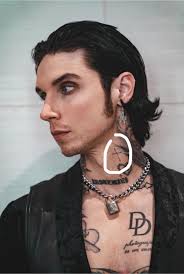 What type of cross is Andy's neck tattoo?