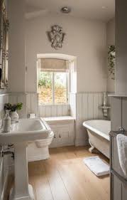 Made from square tiles in different sizes and colors, the bath's mosaic floor is a fresh update on a classic checkerboard pattern. 16 Charming Cottage Style Bathroom Ideas Designs For 2021